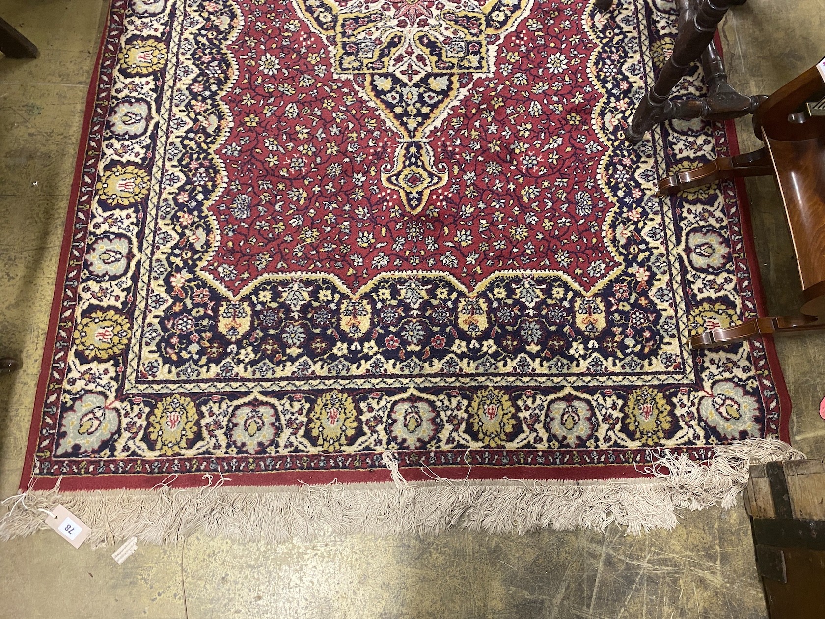 A North West Persian style burgundy ground rug, 200 x 130cm
